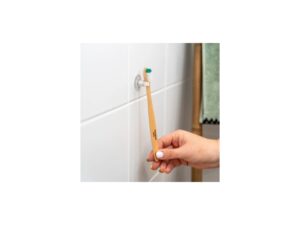 Ventosa amb suport per a capçals o raspalls de dents