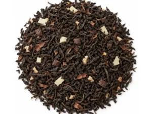 Te negre amb xocolata i cacau a granel, imatge representativa sobre fons blanc
