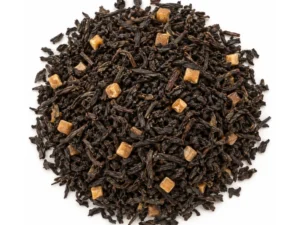 Te negre amb trossets de caramel a granel, imatge representativa sobre fons blanc